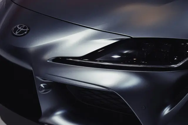 Close-up of a GR Supra headlight and fender